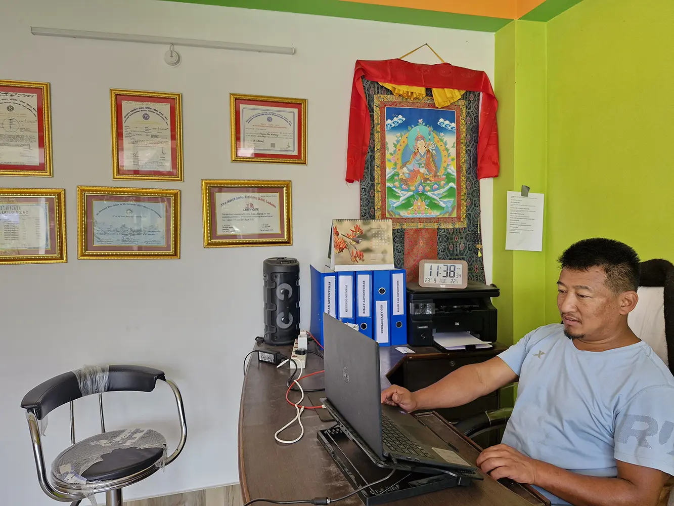 Puspa Lall Gurung founder of Black Yak Expedition, working at the travel office in Sikkim